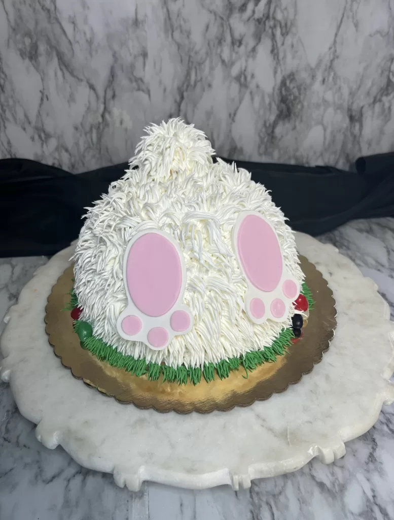 Bunny tail cake with buttercream fur and fondant feet